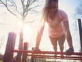 Woman Doing Push Ups in the Park Royalty Free Stock Photo