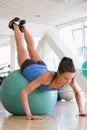 Woman Doing Push Ups On Swiss Ball At Gym Royalty Free Stock Photo