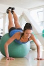 Woman Doing Push Ups On Swiss Ball At Gym Royalty Free Stock Photo