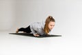 Woman doing push-ups with white gym, stamina and active lifestyle Royalty Free Stock Photo