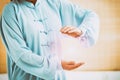 Woman doing qi gong tai chi exercise Royalty Free Stock Photo