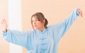 Woman doing qi gong tai chi exercise