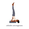 Woman doing Salamba Sarvangasana or shoulder stand pose. Practicing Hatha yoga