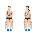 Woman doing seated gluteal and lumbar rotation or chair twist exercise