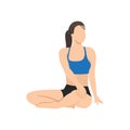 Woman doing seated spinal twist pose parivrtta sukhasana exercise. Royalty Free Stock Photo