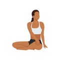 Woman doing seated spinal twist pose parivrtta sukhasana exercise Royalty Free Stock Photo