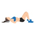 Woman doing semi supine laying down or constructive rest position exercise
