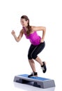 Woman doing step exercise Royalty Free Stock Photo