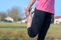 Woman doing stretching exercise before jogging