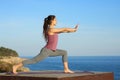 Woman doing tai chi exercise on the beach Royalty Free Stock Photo