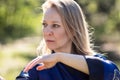 A girl doing tai Chi exercises in a green Park on a Sunny day close up Royalty Free Stock Photo