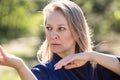 A girl doing tai Chi exercises in a green Park on a Sunny day close up Royalty Free Stock Photo