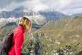 The woman doing trekking in the high mountains in the cool alps on summer days Royalty Free Stock Photo