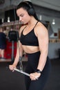 Woman doing triceps exercise by bar Royalty Free Stock Photo