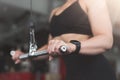 Woman doing triceps exercise by machine closeup Royalty Free Stock Photo