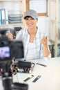 woman doing vlog while repairing computer Royalty Free Stock Photo