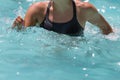 Woman Doing Water Aerobics in an Outdoor Swimming Pool Royalty Free Stock Photo