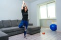 Woman doing workout in morning. Strong sporty girl in sportswear. Fitness exercise. Girl training at home Royalty Free Stock Photo