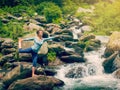 Woman doing yoga asana Natarajasana outdoors at waterfall Royalty Free Stock Photo