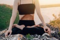 Woman doing yoga belly exercise - Kapalabhati yogic breathing technique. Yogi does uddiyana bandha, while sitting in