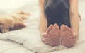 Woman doing yoga exercise on bed at home.