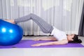 Woman doing yoga exercise with fitness ball Royalty Free Stock Photo