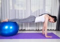 Woman doing yoga exercise with fitness ball Royalty Free Stock Photo