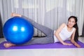 Woman doing yoga exercise with fitness ball Royalty Free Stock Photo