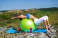 Woman doing yoga exercises on the ball