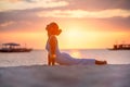 A woman is doing yoga exercises at the sunset on Boracay island, Philippines Royalty Free Stock Photo