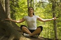 Woman doing yoga in forest at mountain Royalty Free Stock Photo