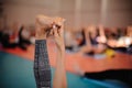 Woman is doing yoga . hand holds feet