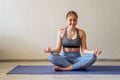 Woman doing yoga at home online (sports exercises) have fun spending good time. Concept of a healthy lifestyle Royalty Free Stock Photo
