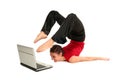 Woman doing yoga with laptop Royalty Free Stock Photo