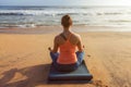 Woman doing yoga Lotus pose oudoors at beach Royalty Free Stock Photo