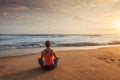 Woman doing yoga Lotus pose oudoors at beach Royalty Free Stock Photo