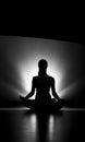 Woman doing yoga meditation silhouette black and white