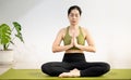 Woman doing yoga plank on the green yoga mat for meditite and excercise in the home Royalty Free Stock Photo