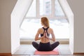 woman doing yoga in reverse prayer pose. Pashchima Namaskarasana