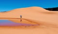 Woman doing yoga on sand dunes. Royalty Free Stock Photo