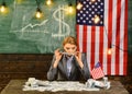 Woman with dollar money for bribe. American education reform at school in july 4th. Economy and finance. Patriotism and Royalty Free Stock Photo