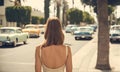 Woman down the 60s California street in vintage vibes