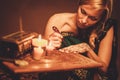 Woman drawing henna menhdi ornament