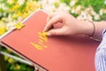 Woman drawing landscape and flowers with soft pastels.