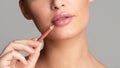 Woman drawing lips with nude pink lipliner Royalty Free Stock Photo