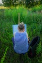 Woman drawing painting in nature