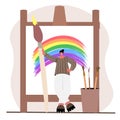 Woman drawing rainbow with a huge brush Royalty Free Stock Photo