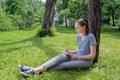 Woman draws sitting on grass