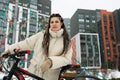 Woman With Dreadlocks Standing Next to Bicycle Royalty Free Stock Photo