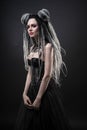 Woman with dreads and black gothic dress